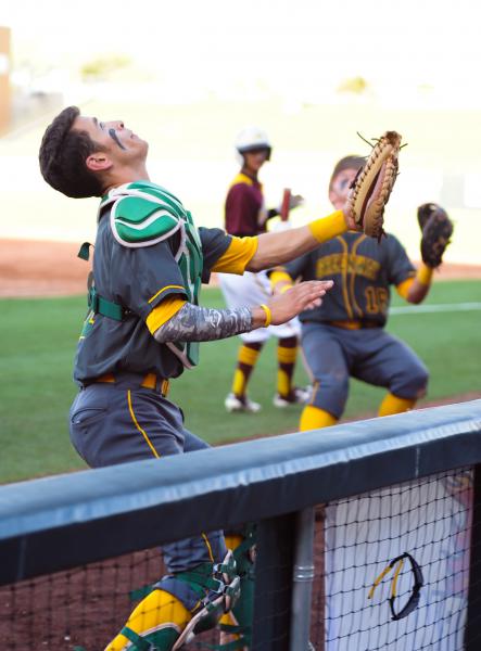 Greenway catcher Zane Butts goes after a foul ball near the Nogales dugout. Photo by Mark Jones/maxpreps.com