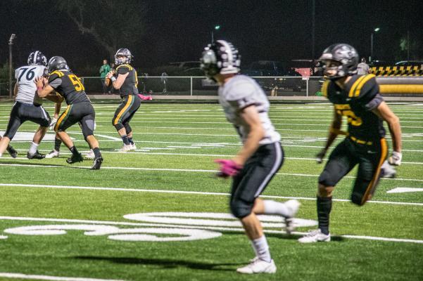 3. Senior Quarterback, Matt Hershey, looking to pass the ball to senior Caden Heyn.jpg