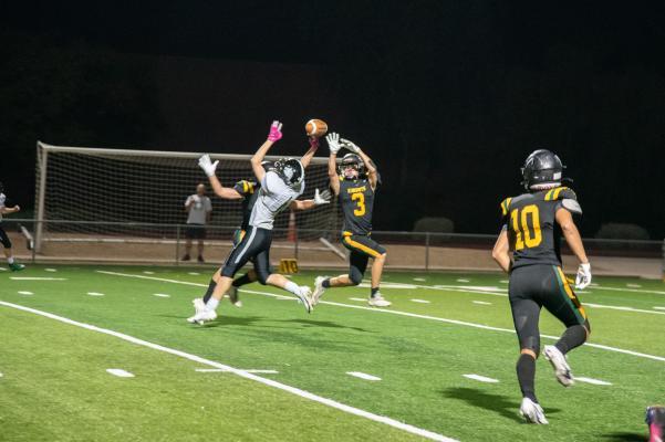 7. Senior Micah Goheen connecting with an awesome leap into the air..jpg