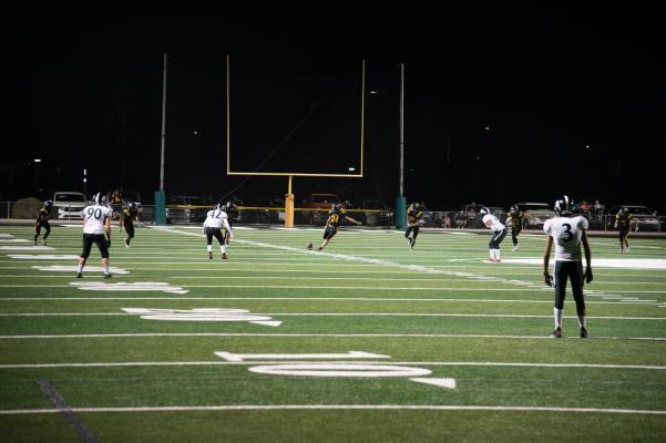 19. Kaleb Powell with the kick off to Arete Prep.jpg