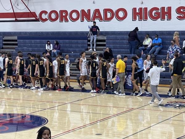 The Dons and the Sabercats shake hands after Saguaro won 59-40 on Wednesday night