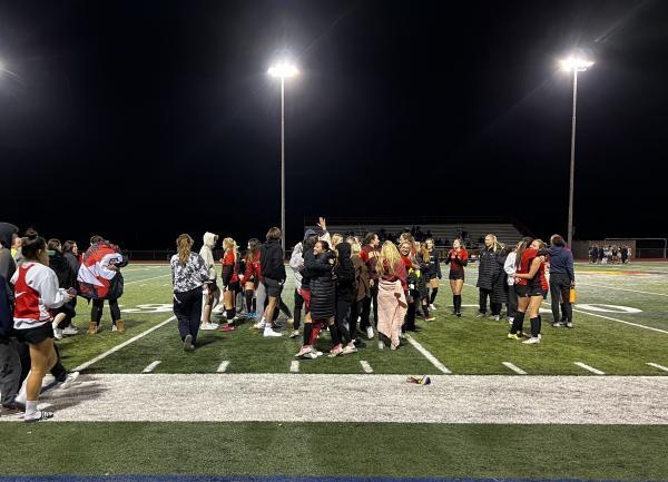 The Chaparral student section rushes onto the field after the final whistle to congratulate the team on their 4-0 win against Pinnacle. (Damon Fairall/AZPreps365)