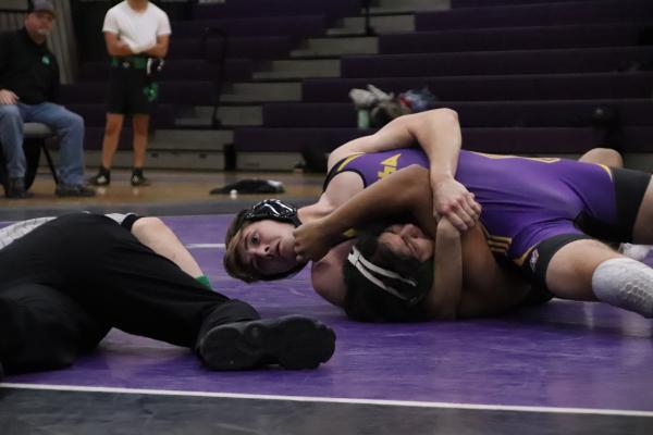 Porter Arnett wrenching for the pin