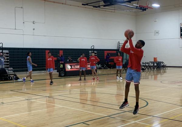 South Mountain freshman Archie Graves warms up before the game. | Adam Schwager
