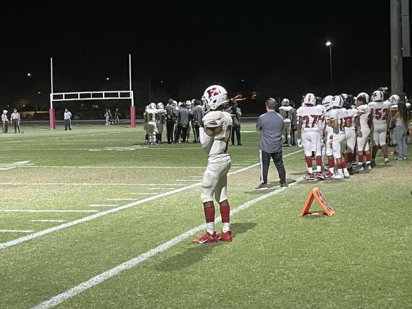 QB Kaleb Burras looks out to the field as he prepares to seal the game for Heritage Academy in the fourth quarter