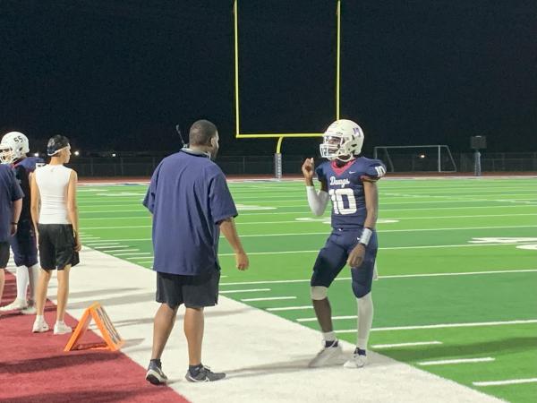 Camar Lee talks to head coach Ty Preyer after a missed pass versus Gila Ridge High School. September 30th, in Phoenix (Oliver Fell/AZPreps365)