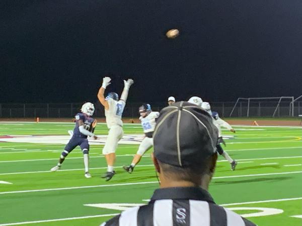 Camar Lee throws a pass over a Gila Ridge defender on a 21-yard passing touchdown to Seth Daily. September 30th, in Phoenix (Oliver Fell/AZPreps365)