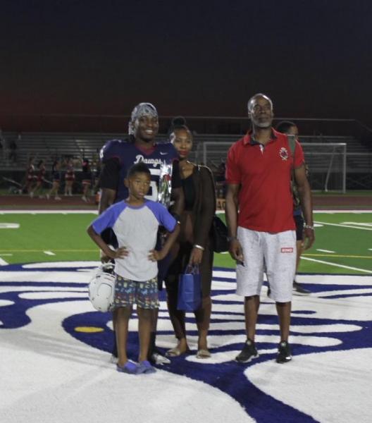Sierra Linda defensive end Lenoxx Hicks on senior night with his father, mother, and younger brother October 19th in Phoenix (Photo via Lenoxx Hicks)