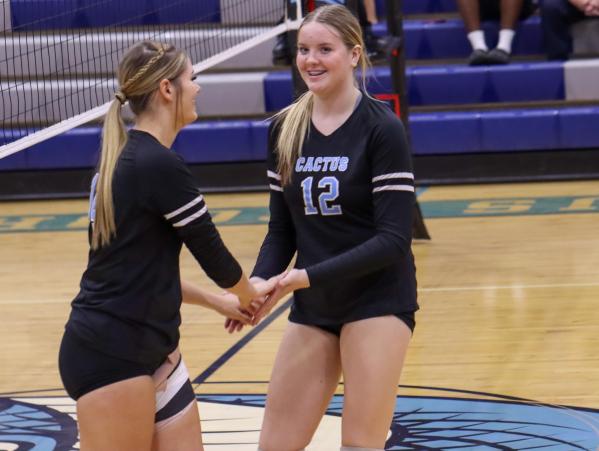 Sapphire Solano (left) celebrates a kill with Kenli Petty (right) in their matchup against Estrella Foothills on Oct. 9.  (Paul Garcia II photo/AZPreps365)