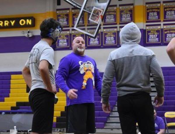 David DiDomenico (center in purple) is expected to take over the Mesa program where he and coach Bobby Williams won three state title. (Submitted photo)