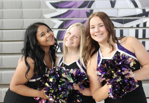 Arizona College Prep’s Spiritline smiling in their home gym. Pictured left to right: Brooklyn Hauber, Eleanor Colombe and Peyton Kokkonen. (Photo courtesy of Reegan Sobieski)