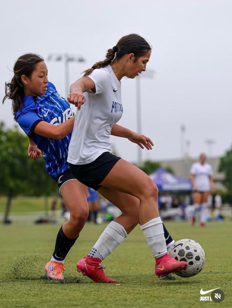 Center back Mila Russo battles for possession for Pateadores during an ECNL league match against Surf San Diego. (Photo courtesy of the Russo family)